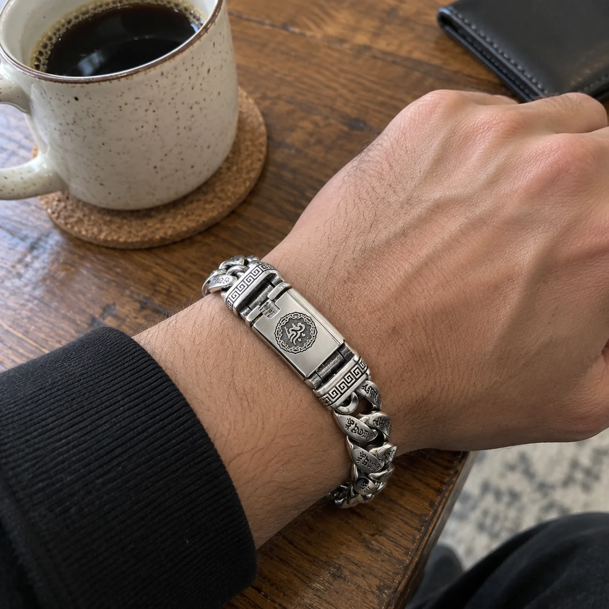 Engraved chain bracelet worn with denim