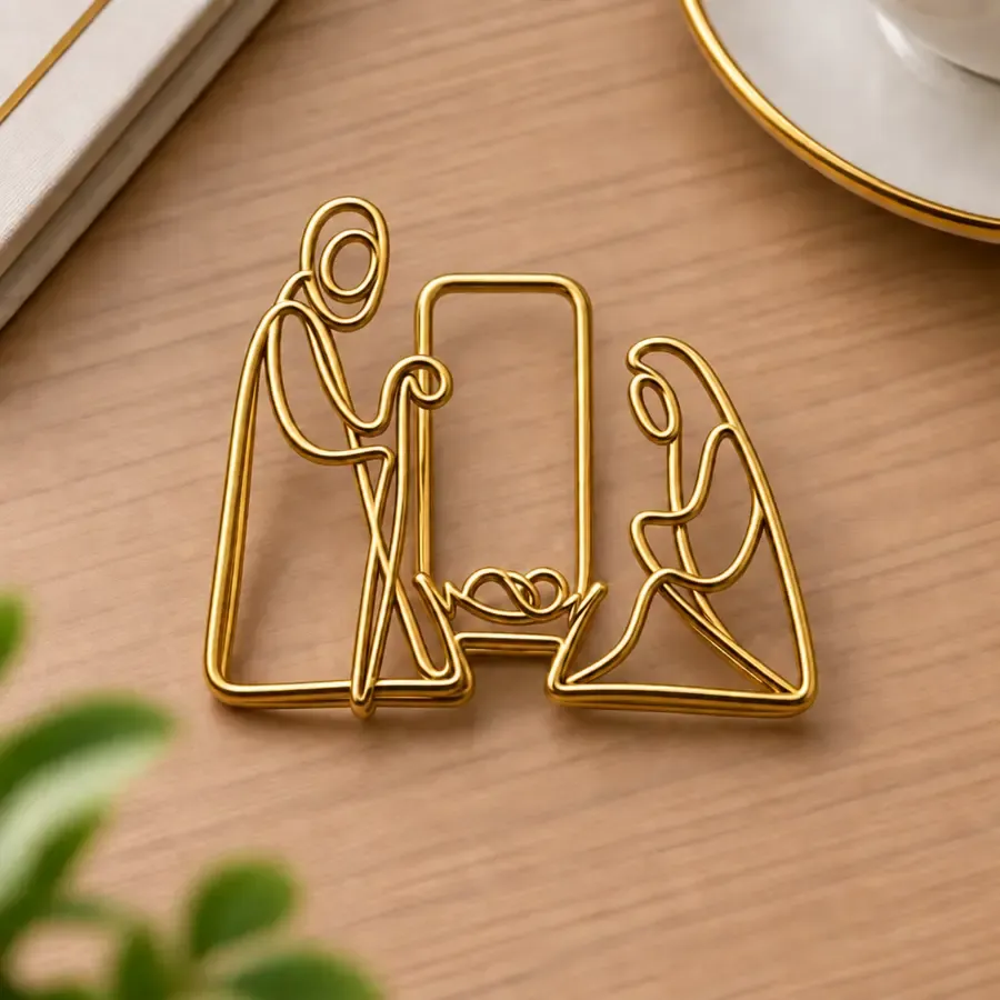 Nativity gold paper clip displayed as a meaningful Christian gift
