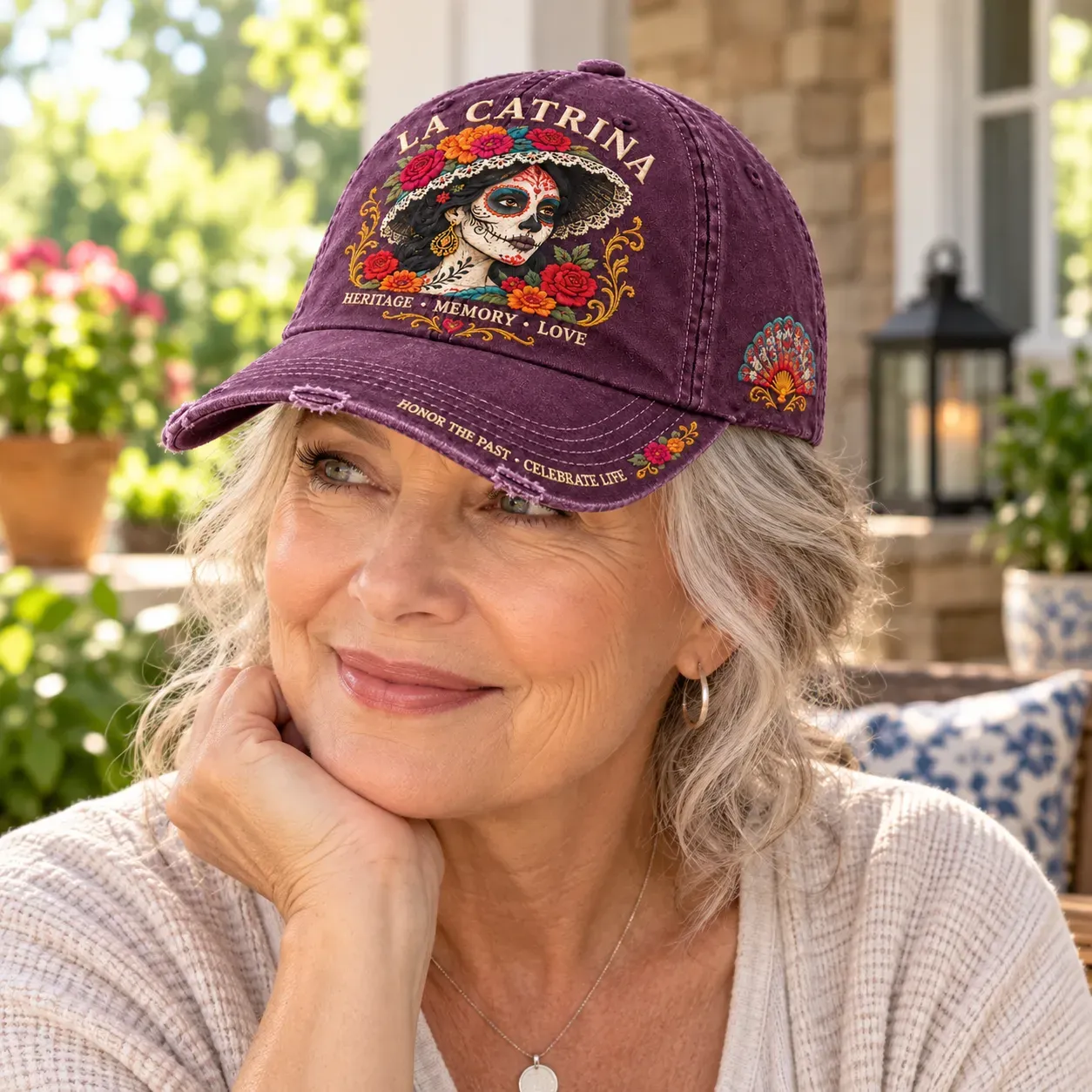 Vintage Plum La Catrina baseball cap worn outdoors, showing the floral portrait and curved brim
