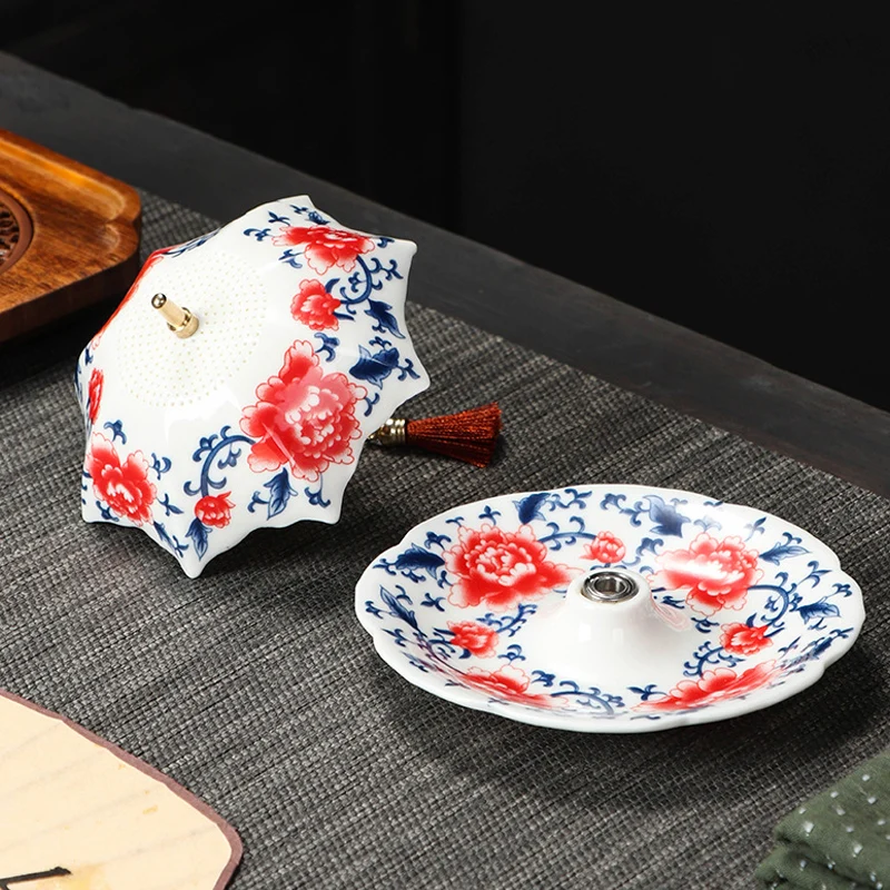 Ceramic umbrella tea strainer and matching saucer