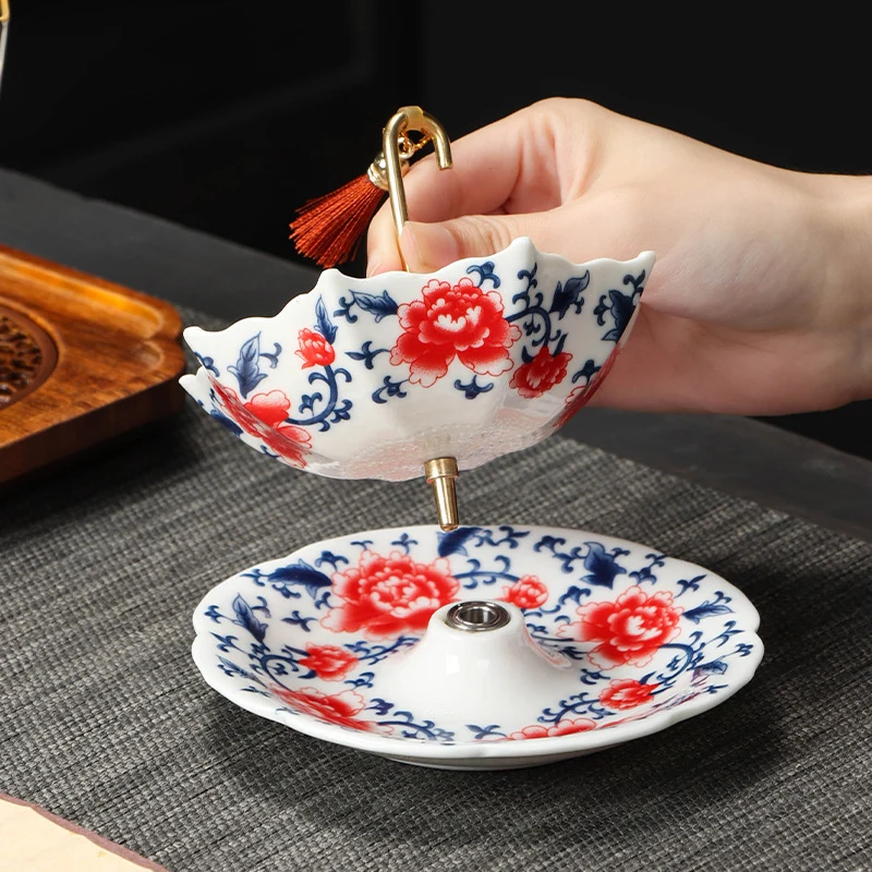 Two-piece umbrella ceramic tea strainer set with matching saucer
