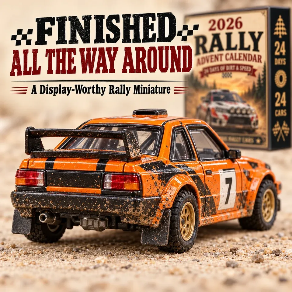 Orange rally car miniature shown from the rear