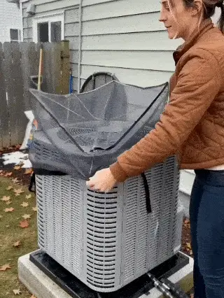 Animation showing the flexible cover being positioned over an outdoor AC unit