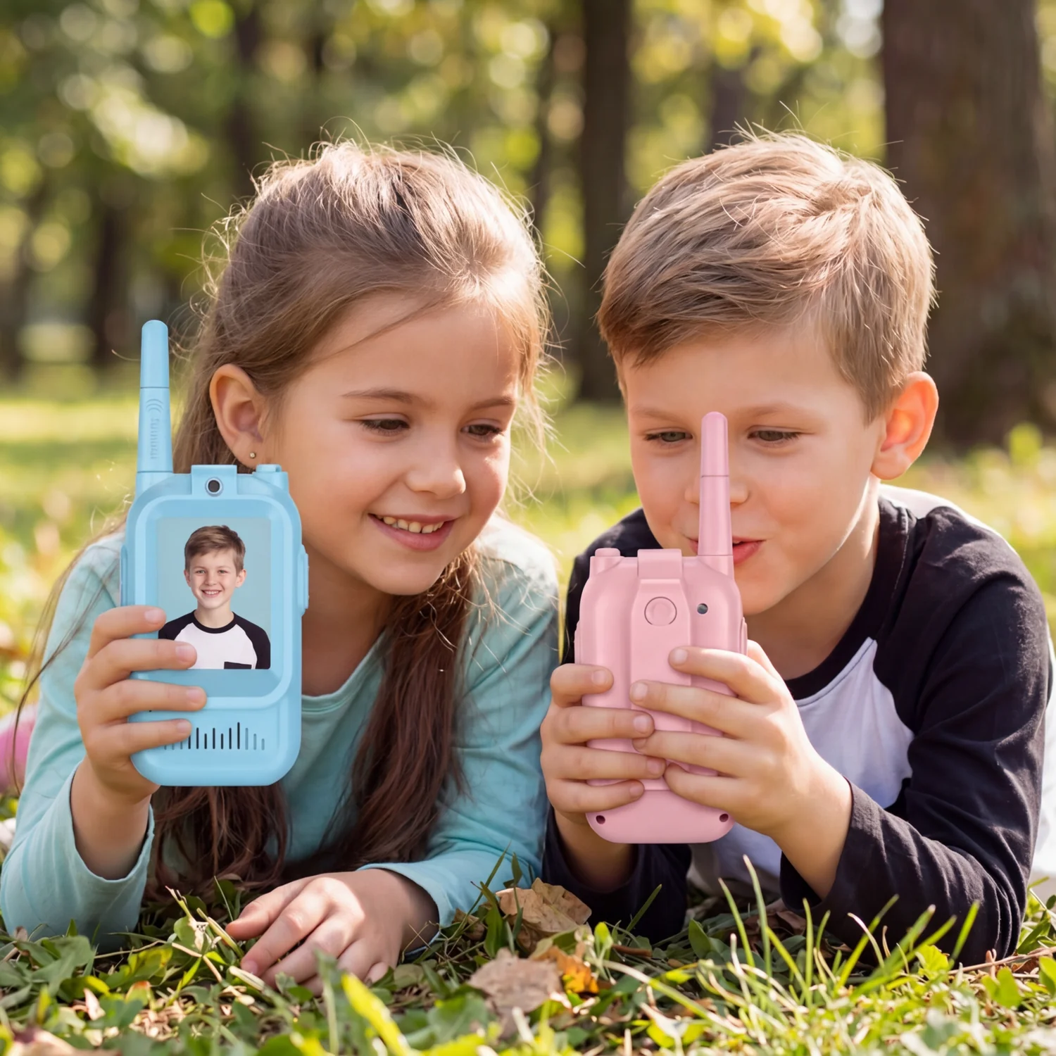 Children playing outdoors with video walkie talkies