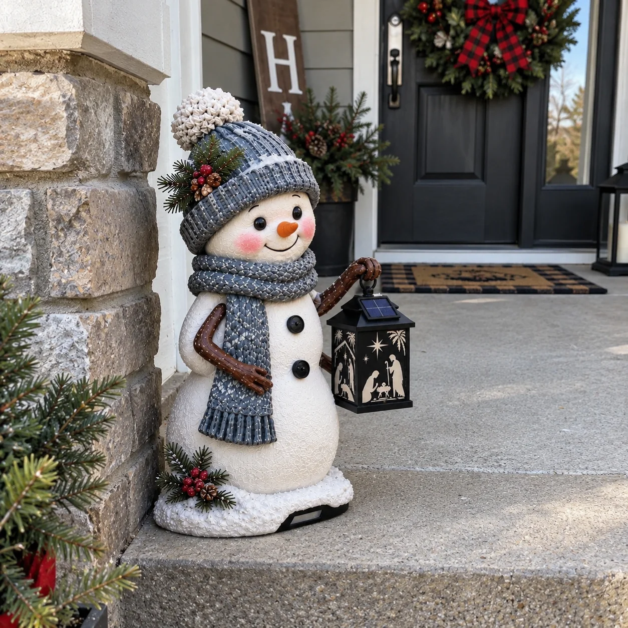 Snowman nativity light being positioned on front step