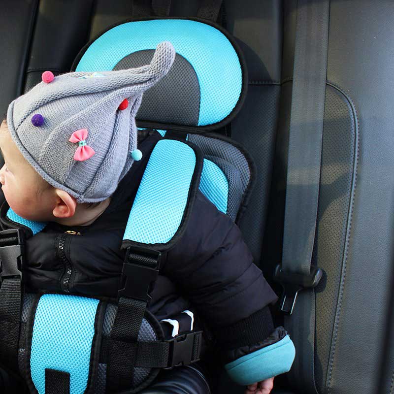 Portable child seating harness in use