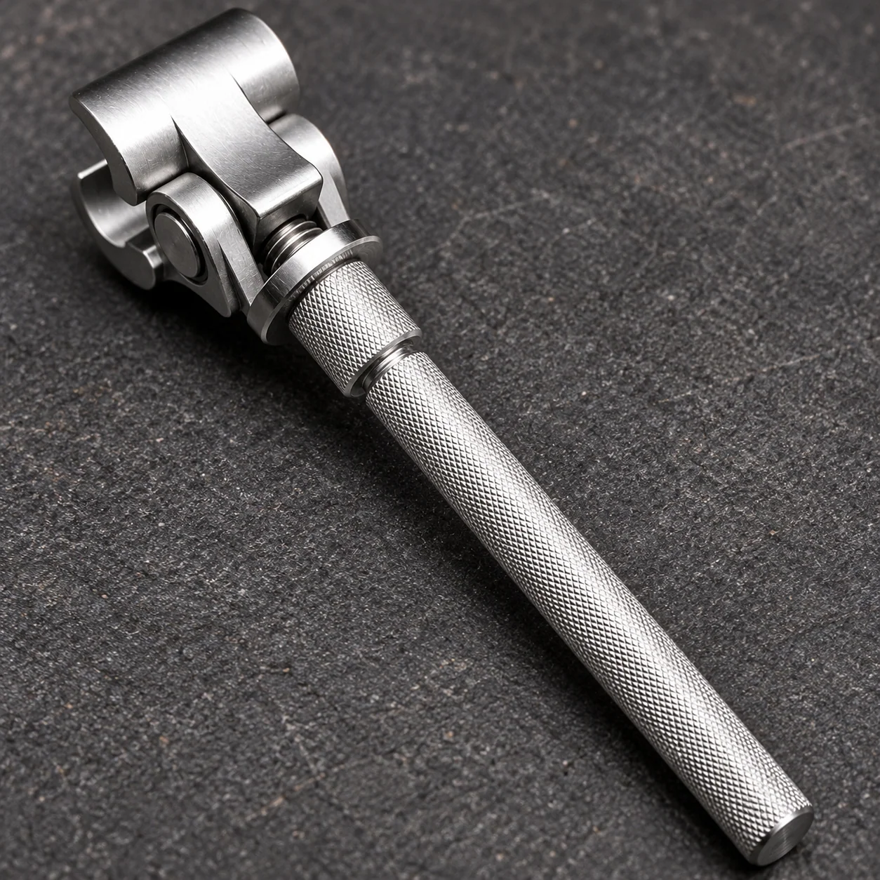 Close view of the steel body, knurled handle and adjustable head
