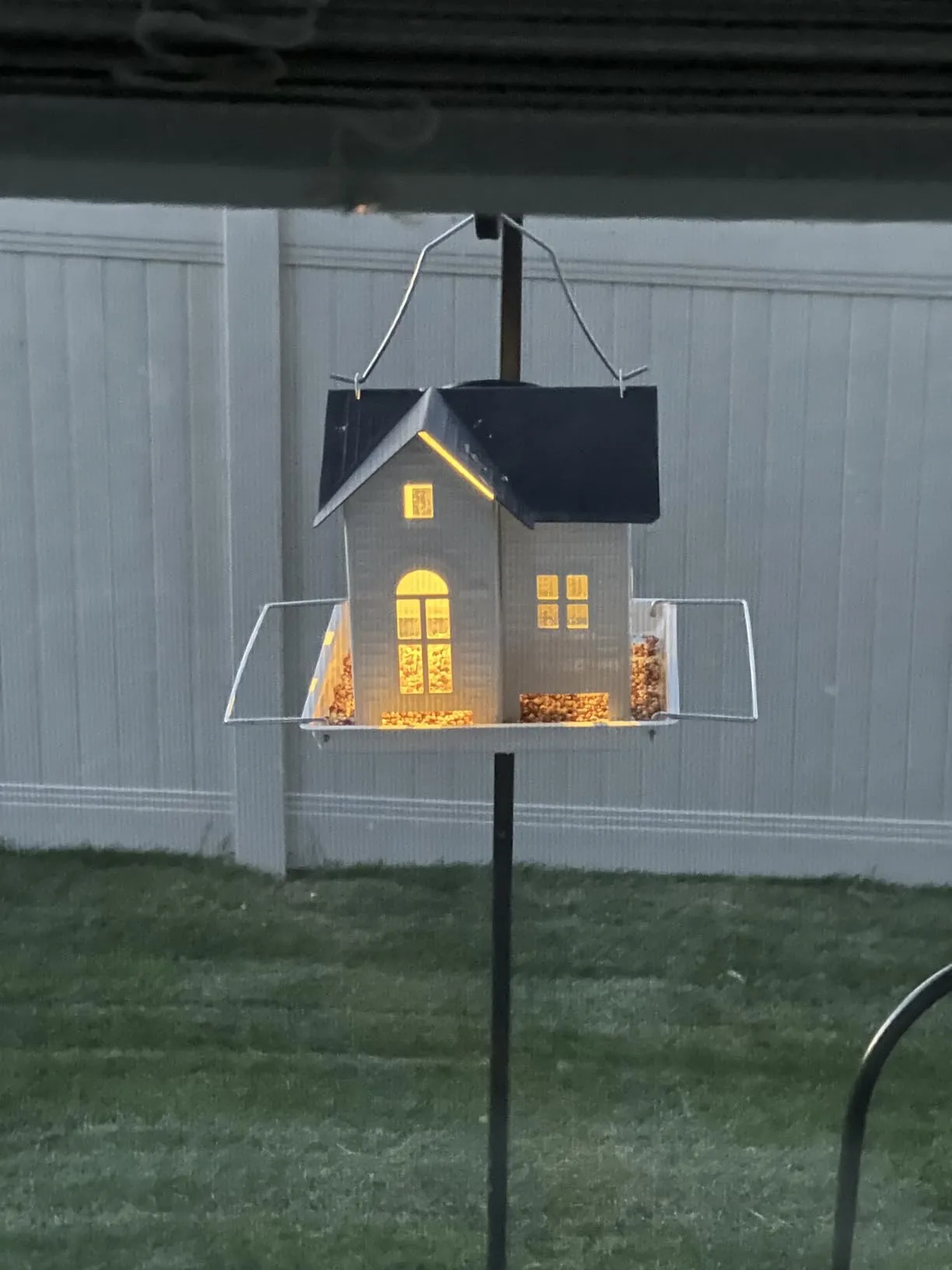 Solar-powered hanging bird feeder for backyard bird lovers