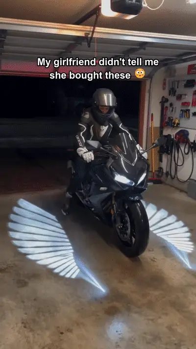 Motorcycle dual-head ground projection lights creating a dramatic light pattern