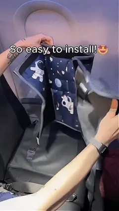 Kids airplane seat extender pictured on an airplane seat