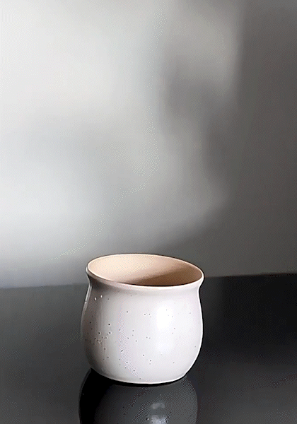 How the cone-shaped drainage mesh insert is used in a flower pot